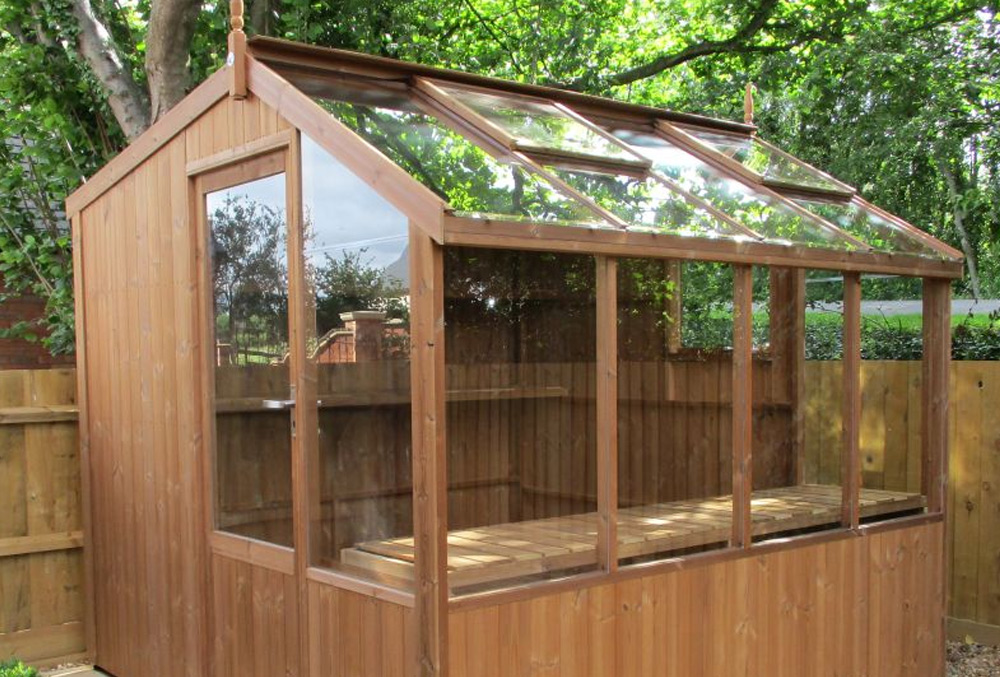 wooden potting shed with glazed roof